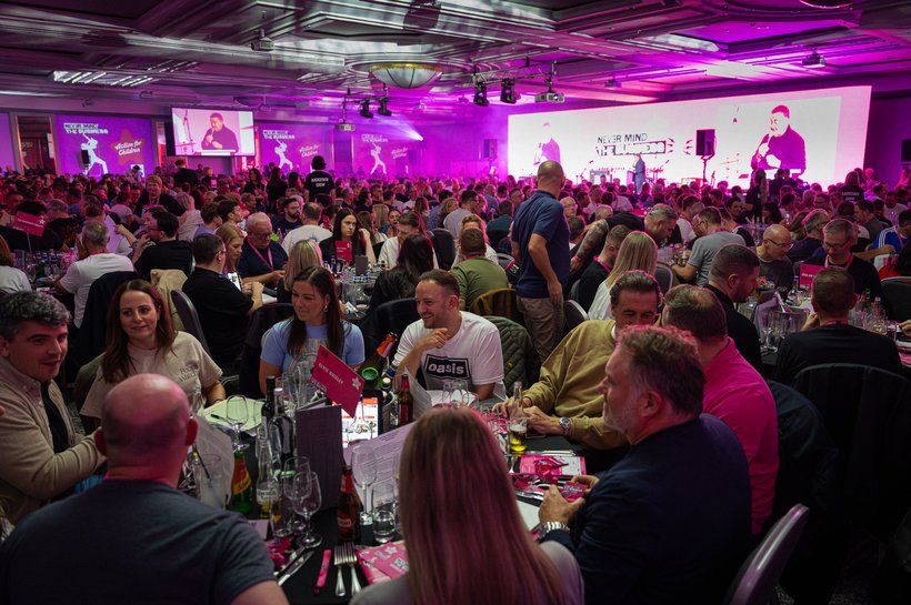 a ballroom full of people at an event