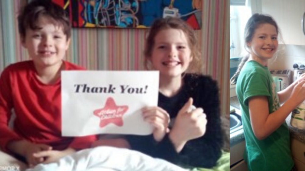 two children holding thank you sign.png