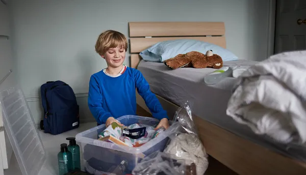Young boy moving into care home