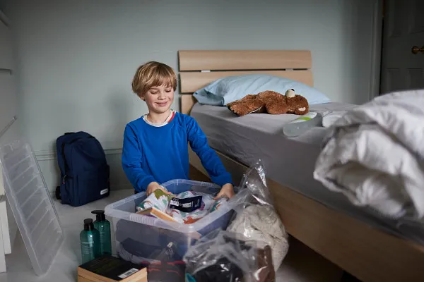 Young boy moving into care home