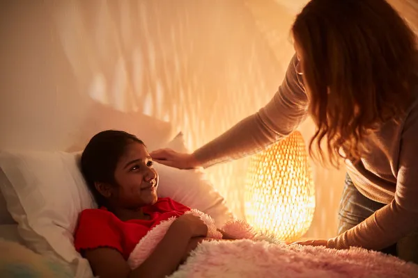 Young person in care saying goodnight to their carer