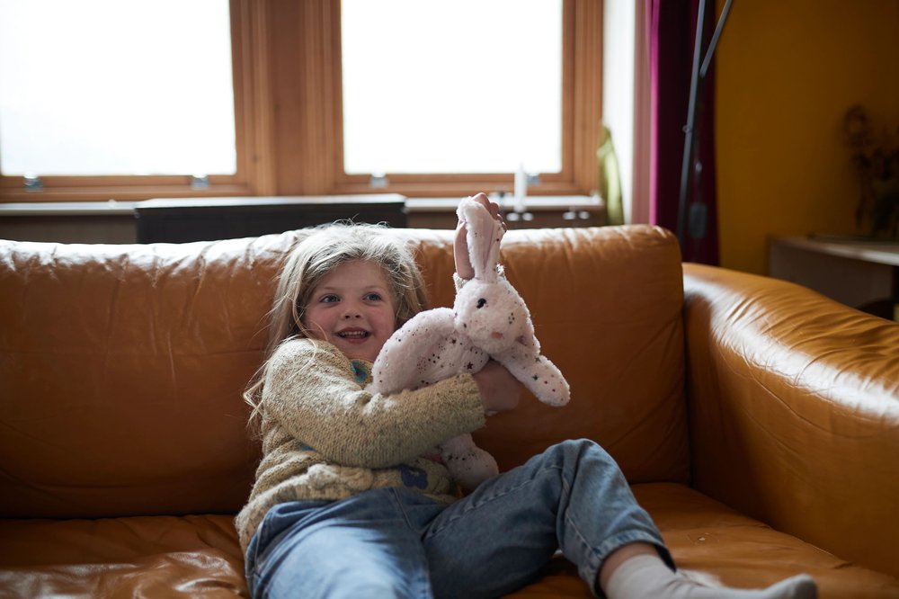 Young girl holding teddy