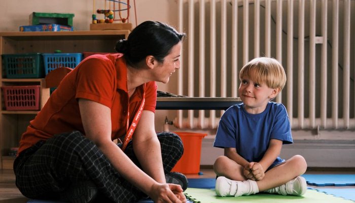 Action for Children worker playing with young boy