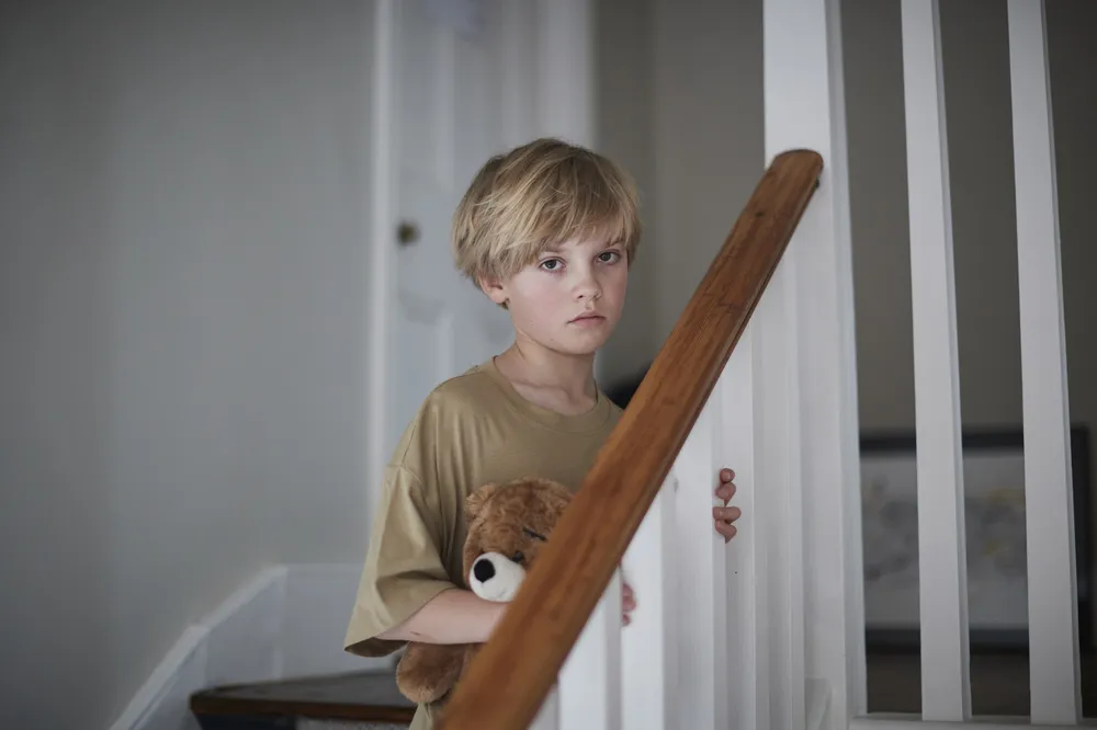 Boy on stairs - children in care