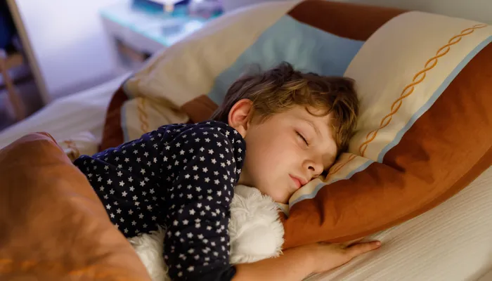 Boy sleeping in bed.jpg