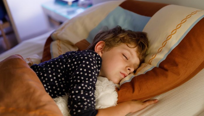 Boy sleeping in bed.jpg