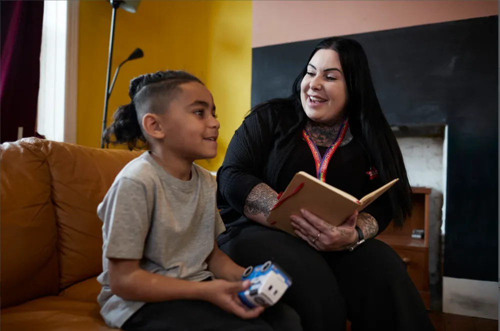 Action for Children support worker talking to boy
