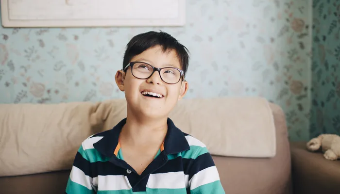 Teenage boy with disabilities laughing
