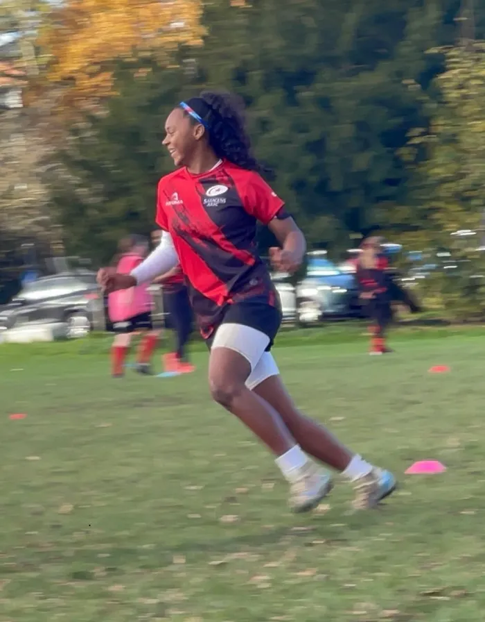 Chan playing rugby