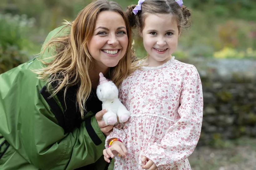 Charlotte Church smiling with young carer who is also smiling