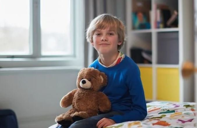 Children in care boy with teddy