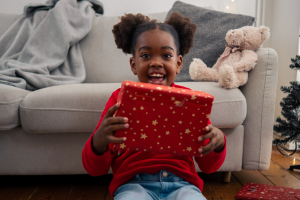 Chloe holding present - happy - cropped