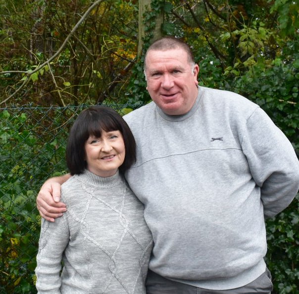 - Colin and Marie holding each other, showing the love and faith that support their fostering through their church