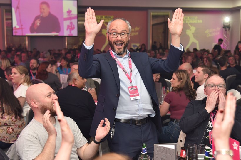 image of man with arms in the air