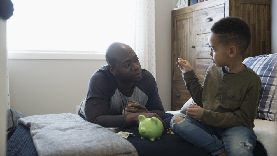 Dad teaching son about money