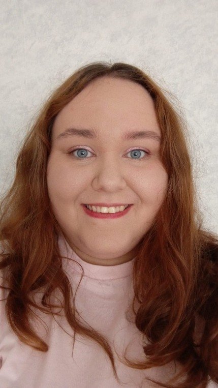 Young Ambassador, Ava, looking at the camera and smiling