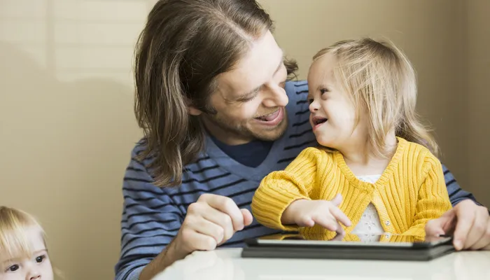 Father smiling at daughter