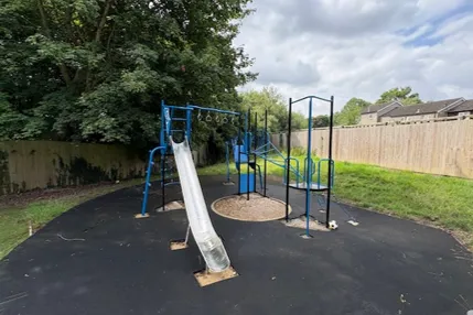 Climbing frame with slide