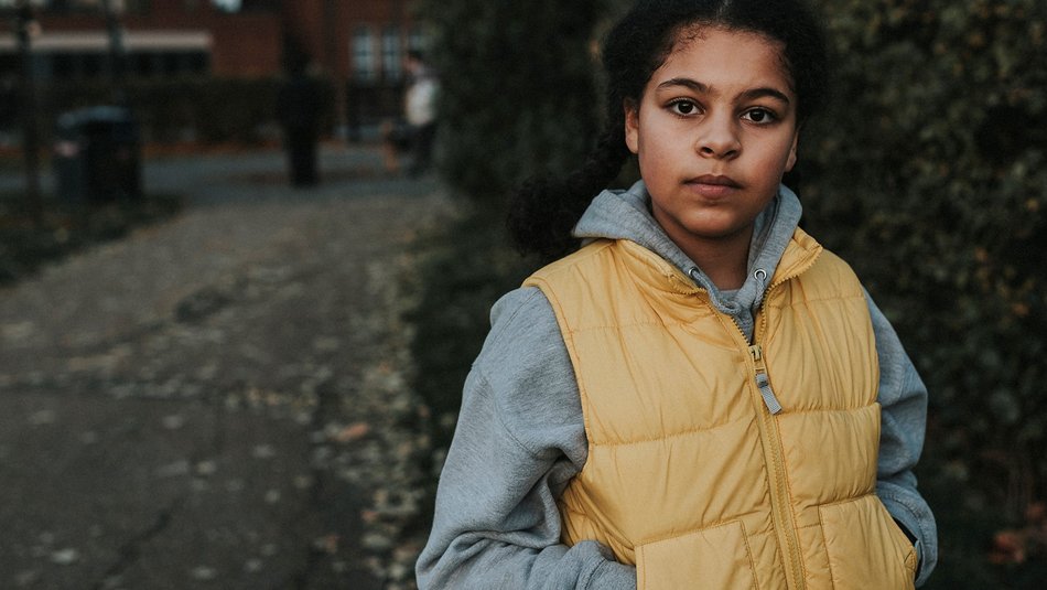 Girl in outside looking straight ahead at camera