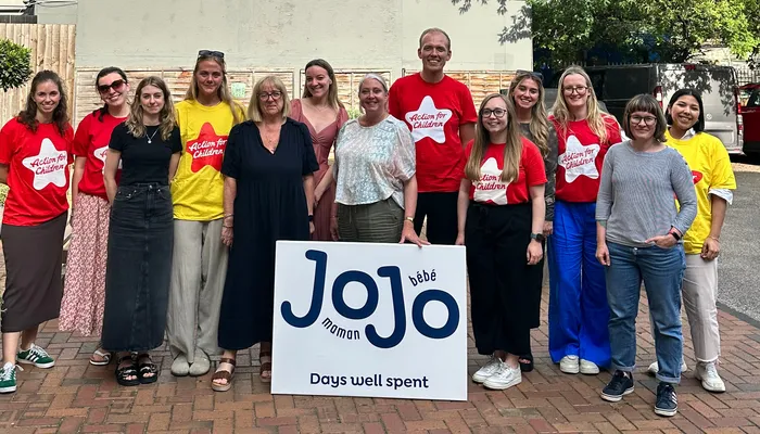 Group of Action for Children staff with JoJo Maman Bebe staff