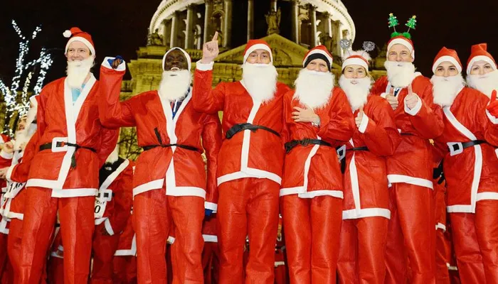 Group of men dressed as Santa for Santa in the City event