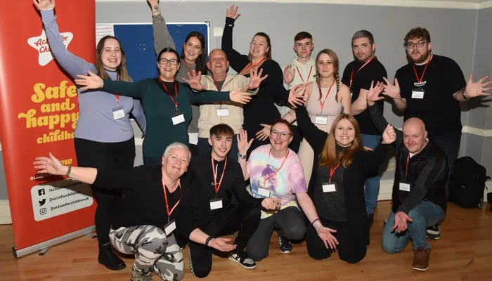 Group of people with hands stretched out for boycott your bed event