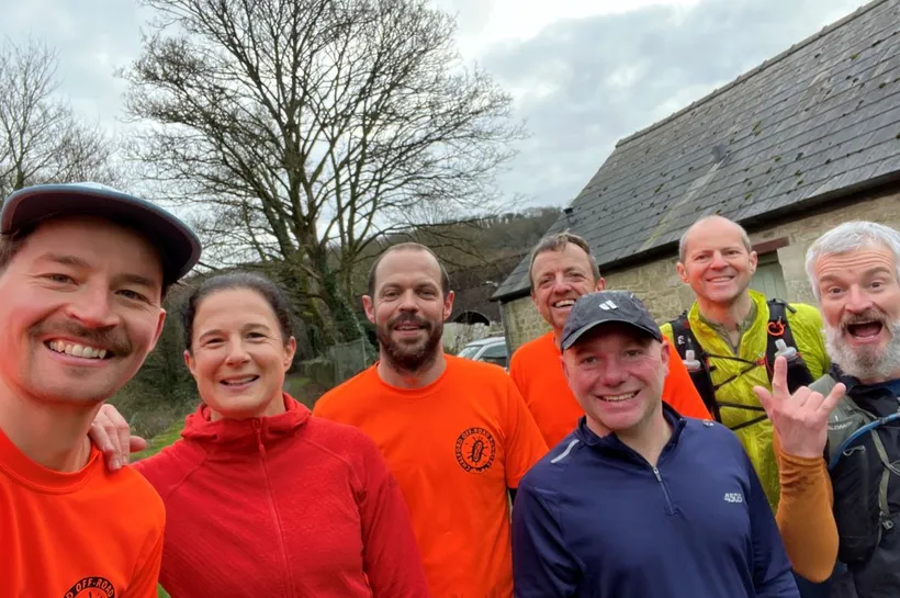Group of people taking a selfie outdoors before a run