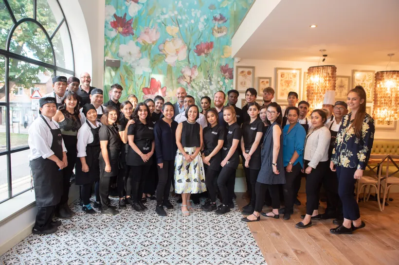 Group of Giggling Squid staff standing in a restaurant