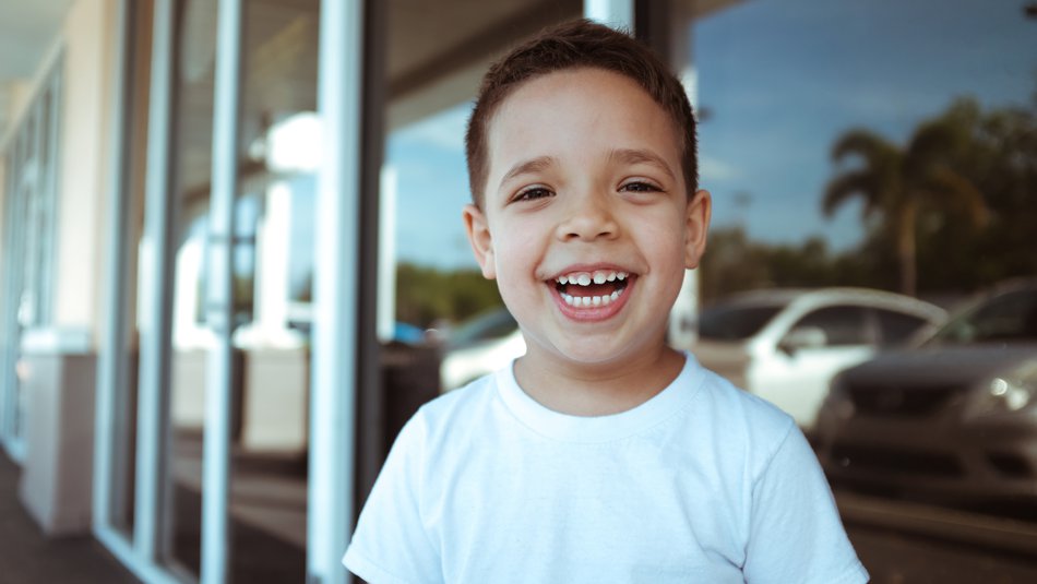 Happy boy smiling to camera