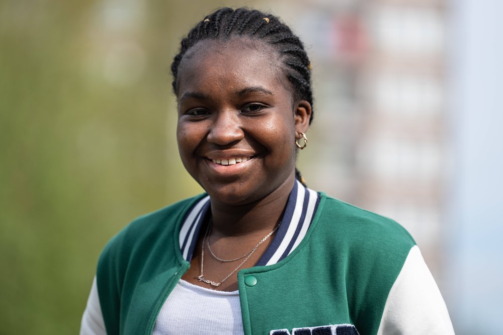 Headshot of Esther smiling at the camera