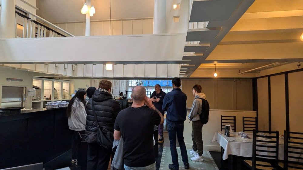 A group of young people standing in a circle, learning about customer service in the workplace