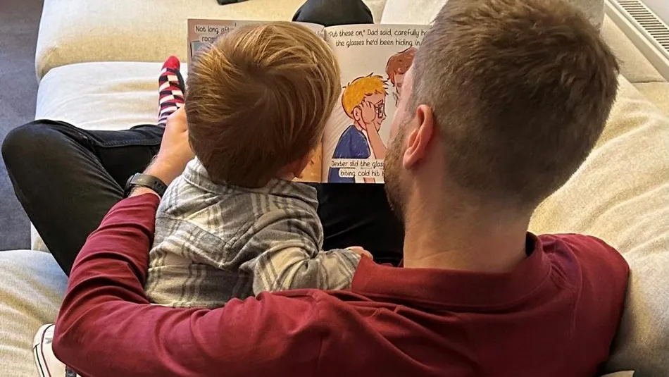 Jack Peedell and nephew reading his book "I Don't Know, Lets Find Out"