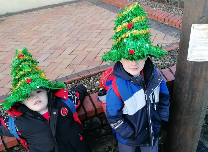 Joel and his brother Kiyan wearing Christmas hats