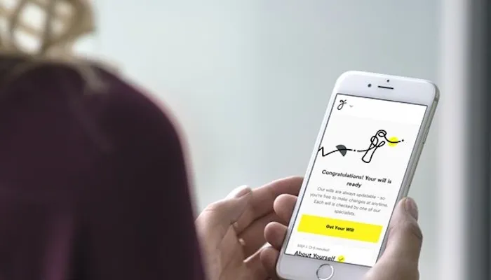 Lady using mobile phone to create a free will.jpg