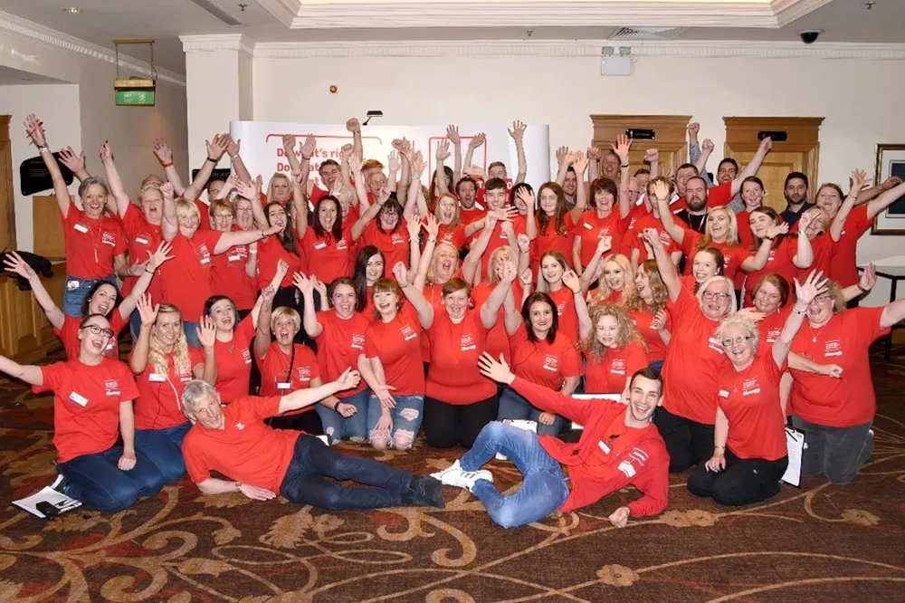 Large volunteer group wearing Action for Children t-shirt