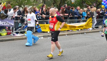London Marathon Runner waving to crowd