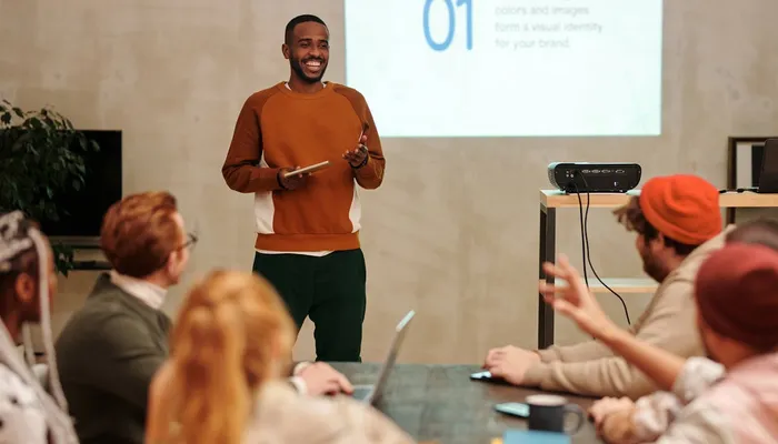 Man in Sweatshirt In Front of People