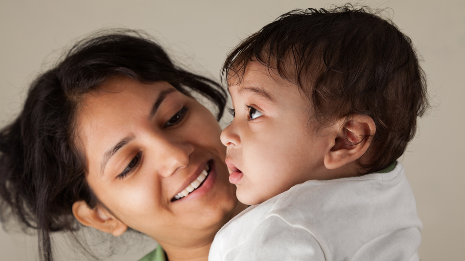 Mother and baby smiling