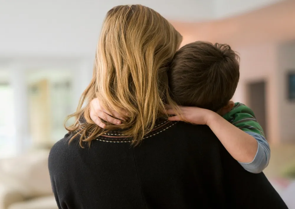 Mother comforting son