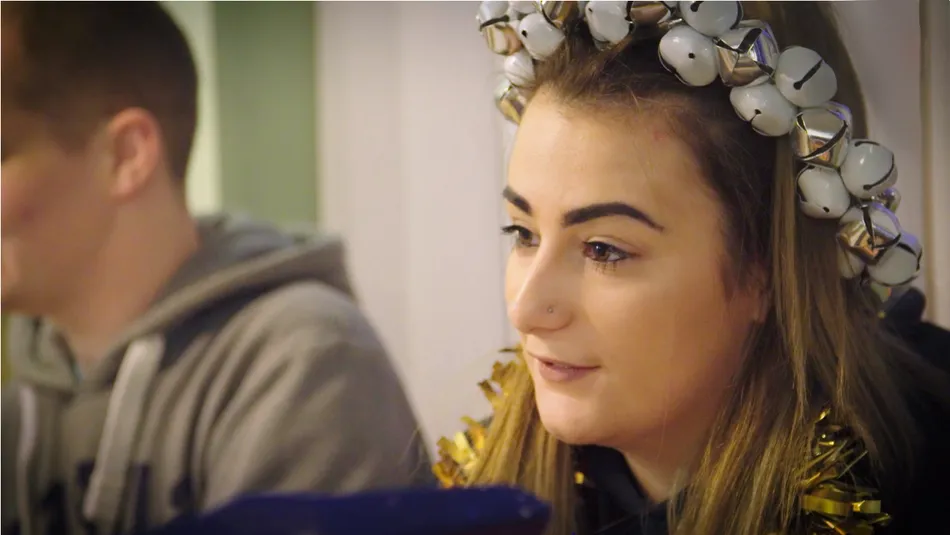 Nicole wearing tinsel at the Christmas table