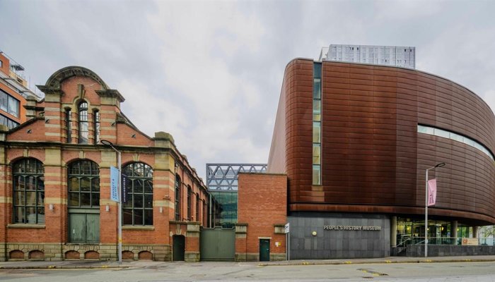 Exterior of the People's History Museum in Manchester, a round rust-coloured building