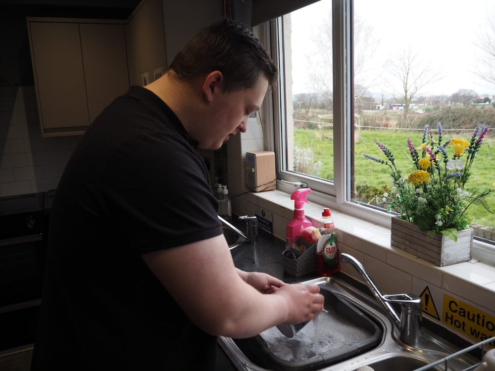 Rhys washing dishes