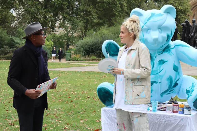 Ronnie Archer Morgan speaking with Sophie Tea outdoors