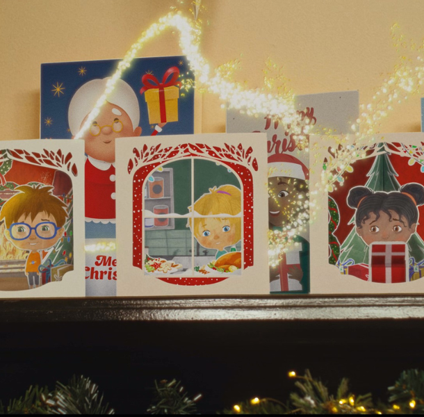 Secret Santa Christmas TV ad Festive mantlepiece with Christmas cards showing ilutrations of three happy children