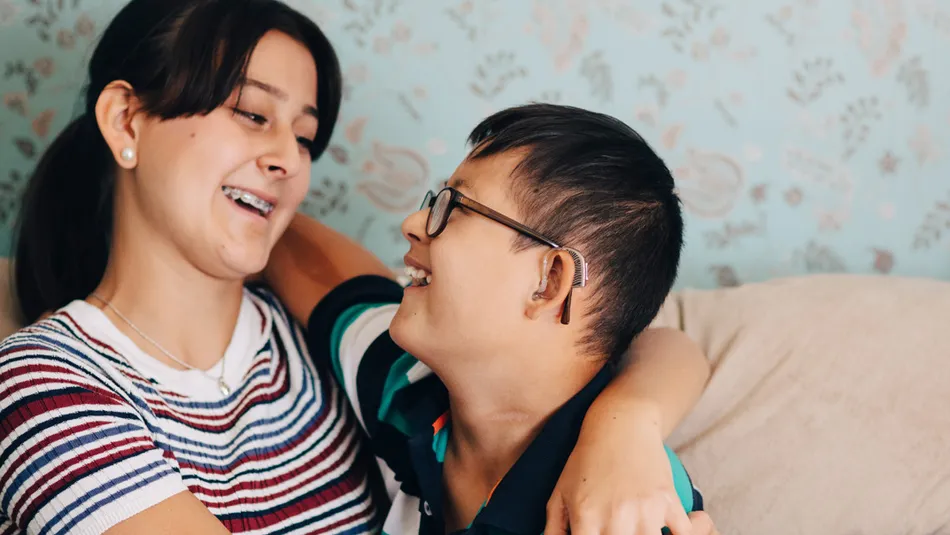 Siblings embracing