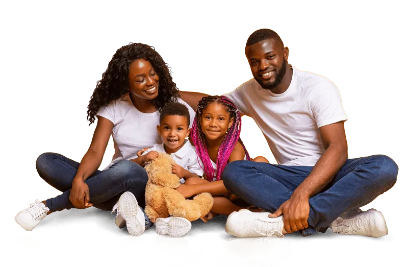 Happy mother and father posing with children and teddy bear