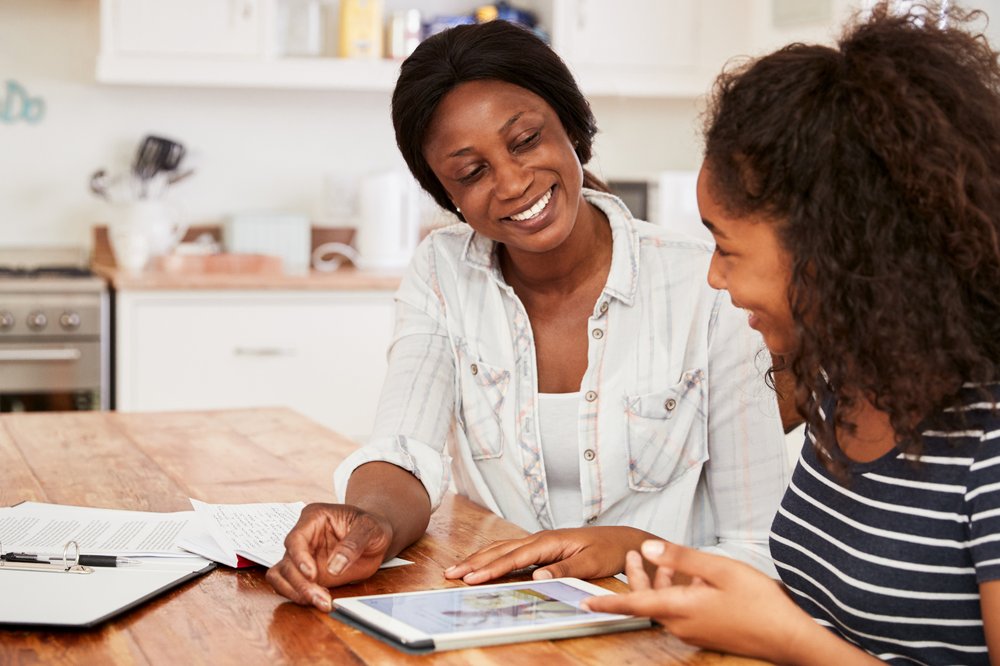 Teenager with carer smiling