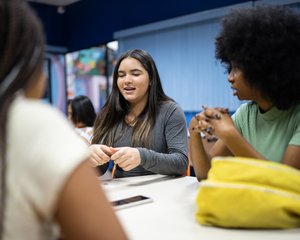 Teenagers in a classroom having a disucssion