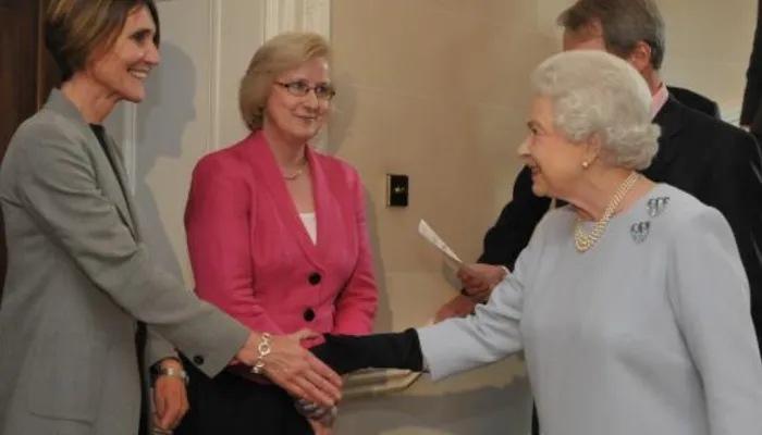 The Queen greeting Action for Children staff