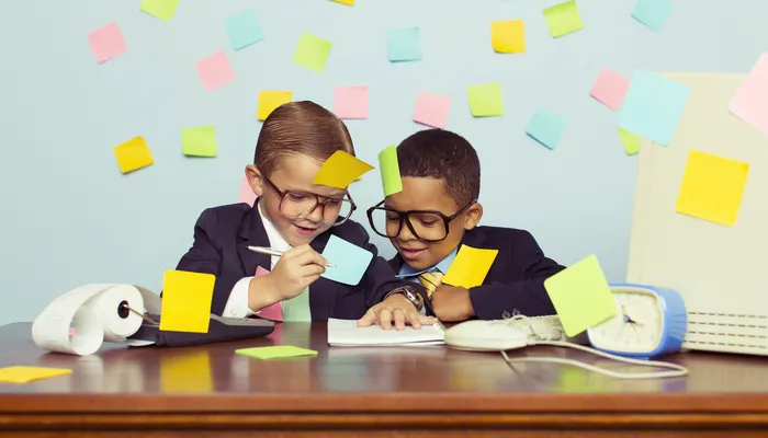 Two young boys dressed as office workers